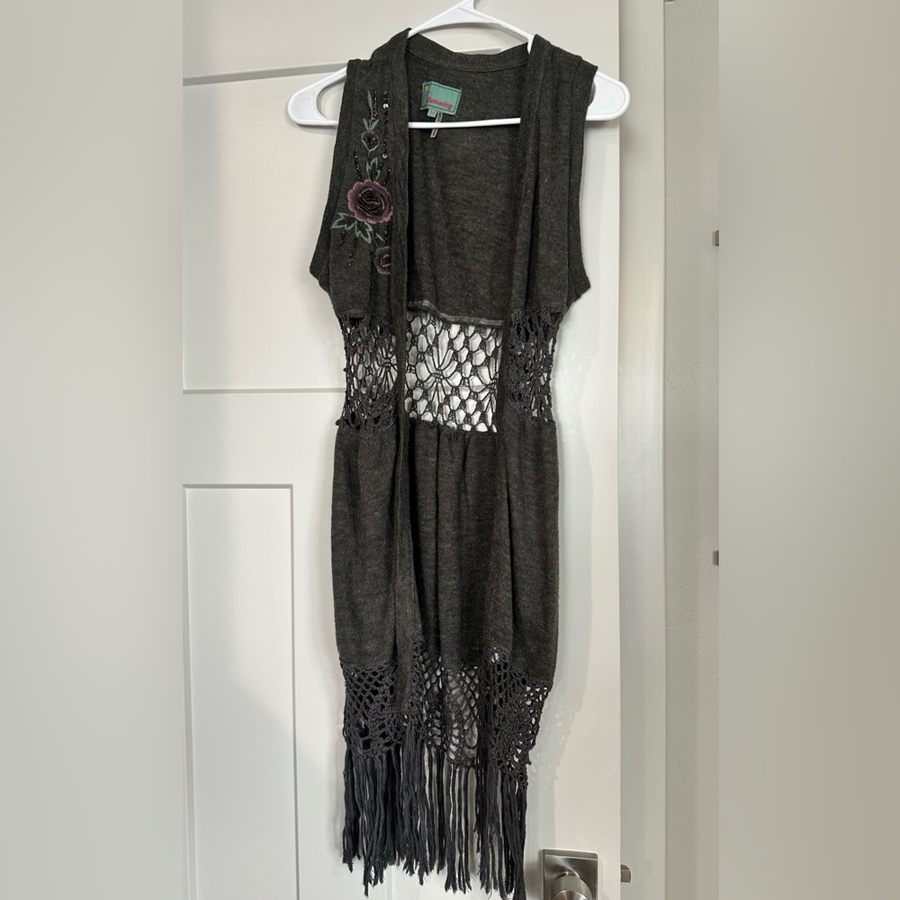 Long sleeveless vest